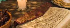 Opened Quran Near Candle Sweet Dates