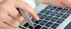 Portrait Of Woman With A Calculator And Pen